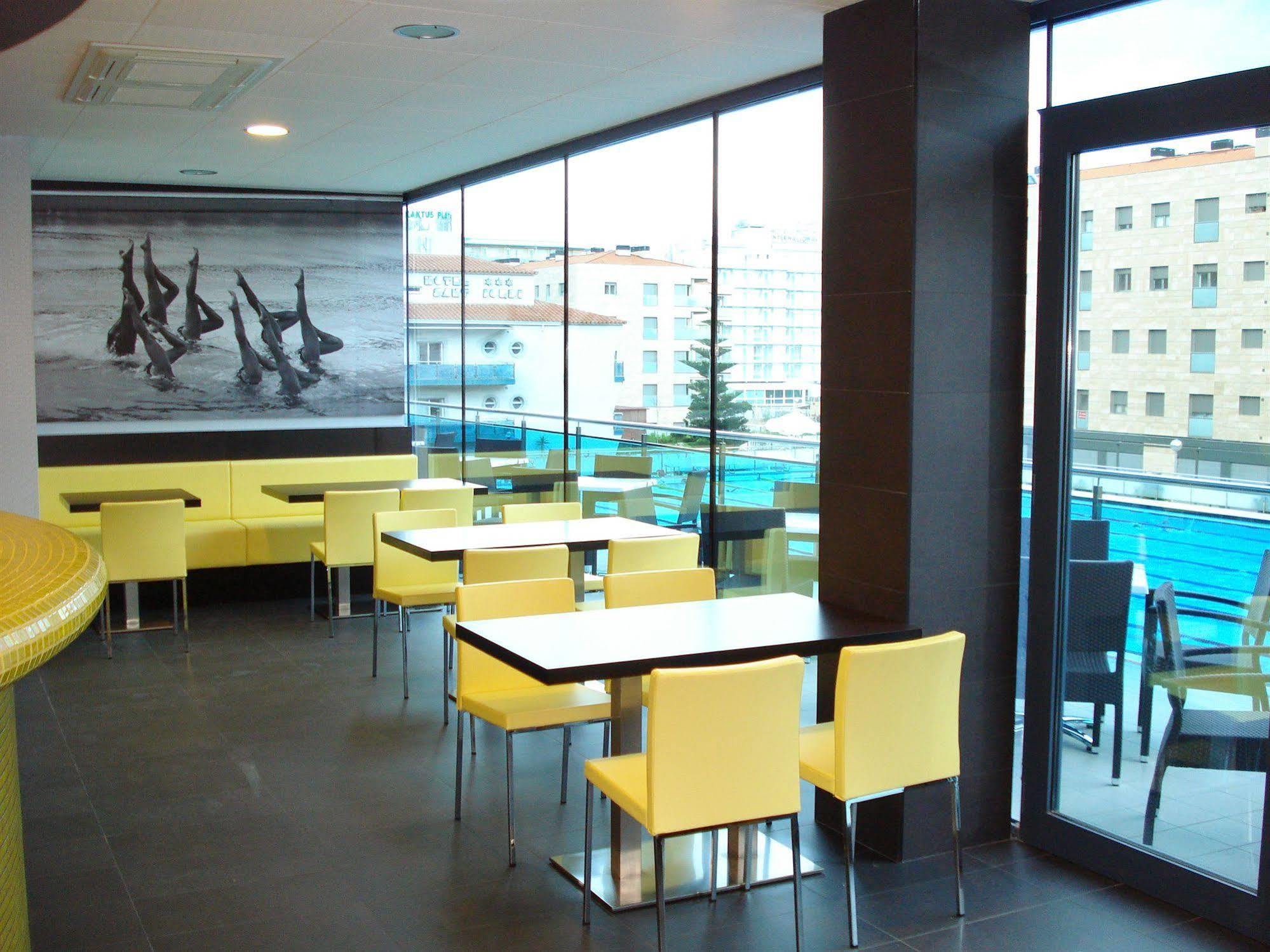 Sant Jordi Boutique Hotel Calella Bagian luar foto Interior of a McDonald's restaurant in Prague, Czech Republic